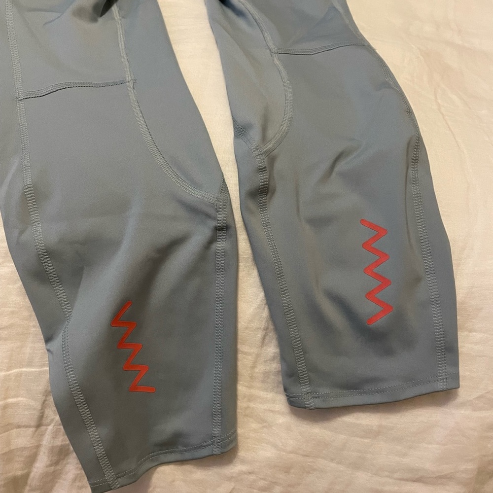 ADIDAS baby blue leggings with neon details.